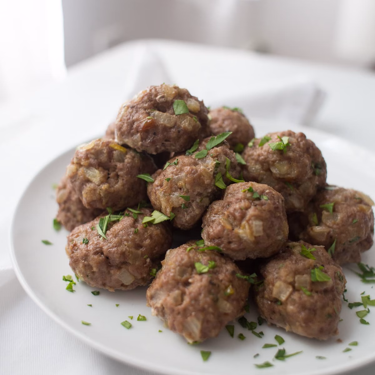 Delicious, evenly shaped meatballs fresh from an advanced production line, showcasing the quality and consistency achieved with Alfa Food & Poultry Projects BV’s innovative meatball processing equipment Delicious, evenly shaped meatballs fresh from an advanced production line, showcasing the quality and consistency achieved with Alfa Food & Poultry Projects BV’s innovative meatball processing equipment